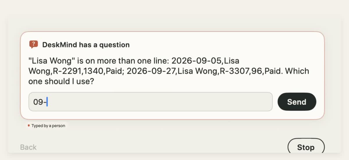 DeskMind asks which of two matching orders to use, and a person types the answer